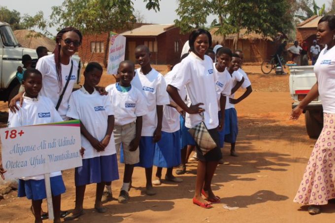 Children with sign against child marriage