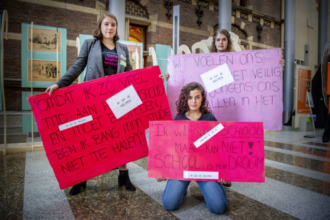 Girls Right Watch with posters/signs